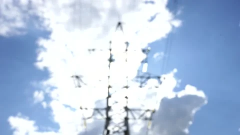 Loop of of an electricity pylon shot from a low angle, Video stock 137260153