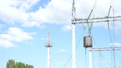 Loop of of an electricity pylon shot from a low angle, Video stock 137263525