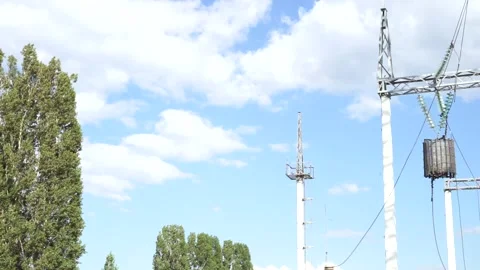 Loop of of an electricity pylon shot from a low angle, Video stock 137263641