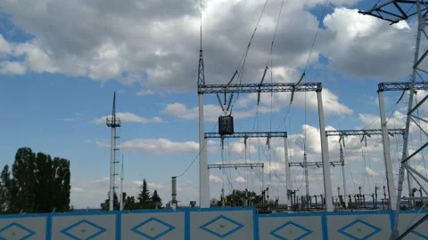 Loop of of an electricity pylon shot from a low angle, Video stock 137388622
