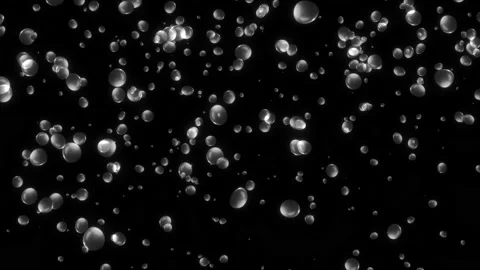 Loop falling down bubble particles animation on black background. Stock Footage 213415435