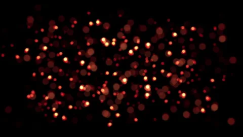 Loop glow orange red bokeh particles animation on black background Stock Footage 310787670