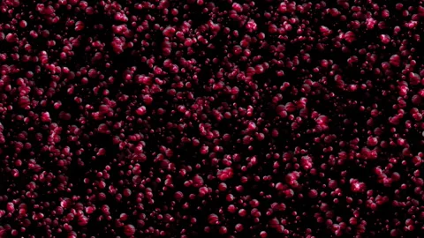 Loop glow red energy ball particles fire falling down Stock Footage 305843783