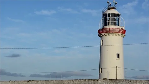 Loop Head Lighthouse over Blue Sky in Clare, Ireland Stock Footage 77838614