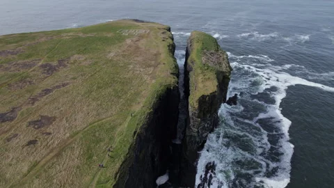 Loop Head Peninsula, Ireland. Drone Shot of Rugged Cliffs and Rock Stack Above Stock Footage 344169865