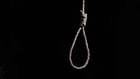 Loop knot sways in a dark room Stock Footage 129515872