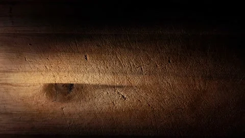 Loop of light spot passing vertically over wooden cutting board background pa Stock Footage 146158764