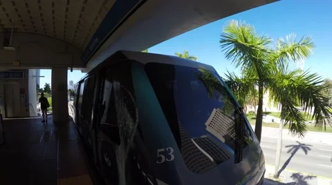 Loop Metromover train departing Bayfront Park in Downtown Stock Footage 50503059