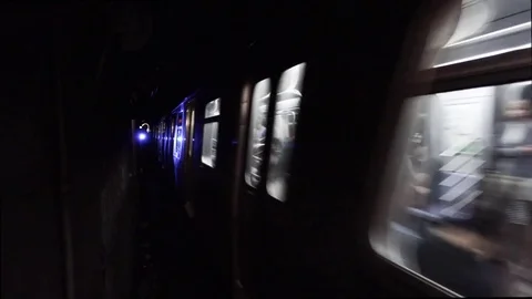 Loop of NYC subway moving through dark tunnel. Stock Footage 76196379