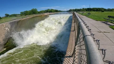 Loop of the outflow of Saylorville Lake Dam and the Des Moines River in Stock Footage 284212489