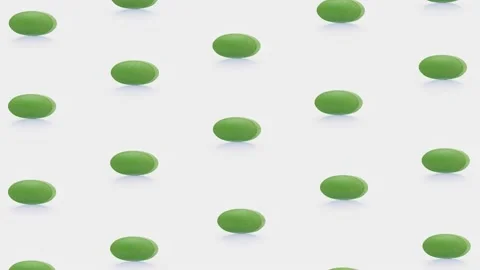 Loop pattern 4k Green pills rotate on a white background Isolated Motion loo Stock Footage 231569016