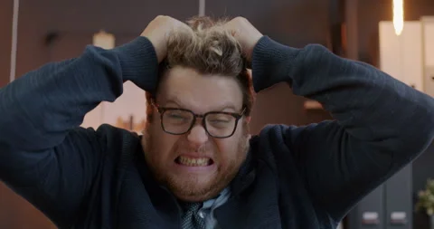 Loop portrait of crazy businessman pulling hair and screaming expressing anger Stock Footage 276351083