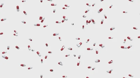 Loop of Red and White Pills Falling on a White Background 库存影片 72420054