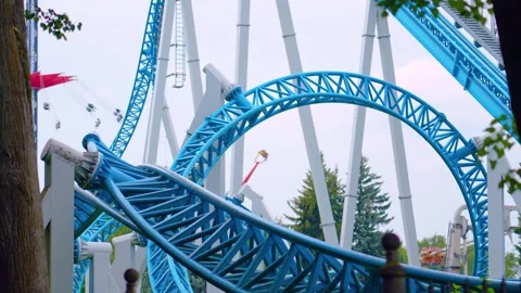 Loop roller coaster in an amusement park Stock Footage 295945157