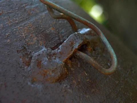 A loop on a rusty surface with a twisted wire Stock Photos