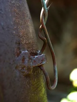 A loop on a rusty surface with a twisted wire Stock Photos