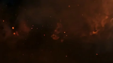 Loop Sparks of bright orange flying embers burn on black background Stock Footage 314665498