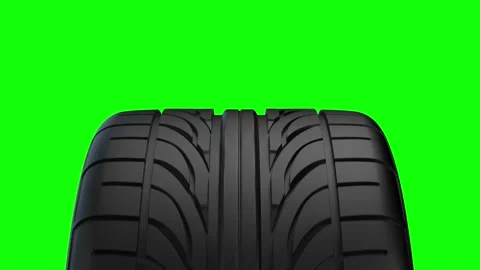 Loop Spinning car wheel on a green background Video stock 146196270