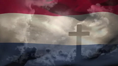 On loop start flag stripes rippling around cross silhouette while clouds 库存影片 311225125