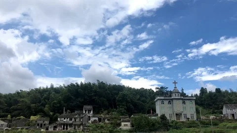 Loop of A static timelapse of  small village with cloudy sky passing through Stock Footage 125591814