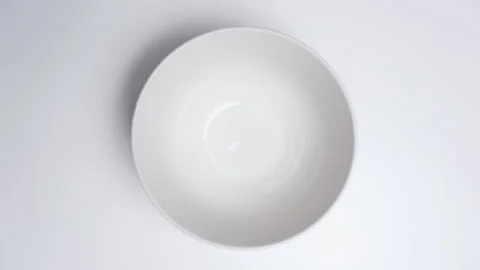 Loop stop motion of colorful jelly beans disappearing and reappearing in a white Stock Footage 346752759