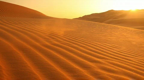 Loop sunset in dunes with sand blowing Stock Footage 562863