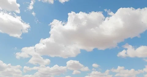 Loop of white clouds over blue sky time lapse movement Stock Footage 77839434