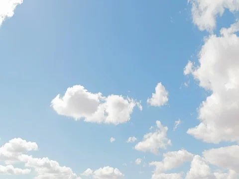 Loop of white clouds over blue sky time lapse movement, climate change Stock Footage