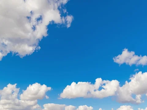 Loop of white clouds over blue sky time lapse movement, climate change Видео 85076406