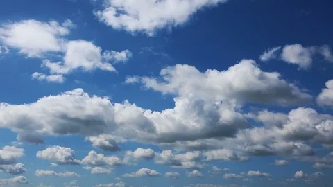 Loop of white running clouds over blue sky. Stock Footage 87397980