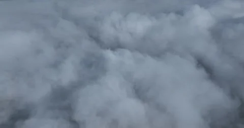 Loopable abstract swirling smoke and a soft fog and blue sky Stock Footage 324878587