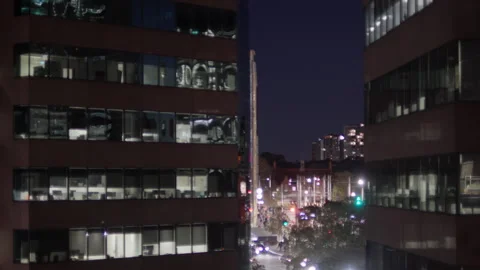 Loopable Background plate of cityscape at night, traffic &amp; office buildings Stock Footage 314932371