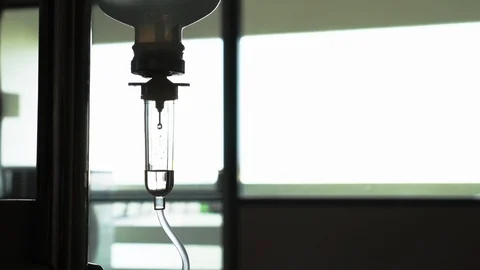 Loopable Cinemagraph Video. Silhouette of saline solution drip for patient Stock Footage 86861738