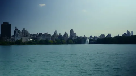 Loopable Daytime View Over Central Park Lake with Manhattan Skyline Stock Footage 322053264