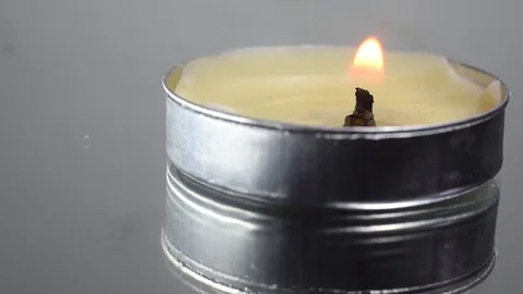 Loopable footage of a burning circular scented candle Stock Footage 76935856