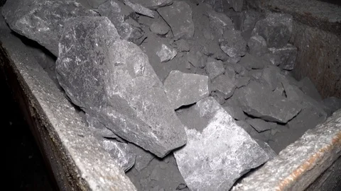 Loopable footage of mine wagons full of ore in dense smoke Stock-Footage 97158576