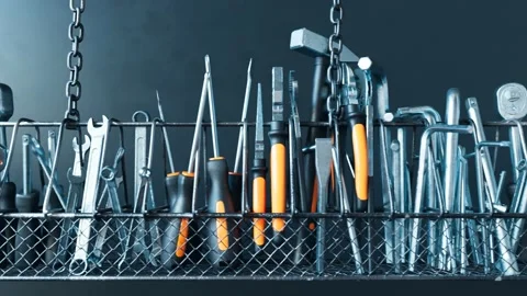 Loopable footage of various garage hand tools. Workshop equipment organizer. 4K Stock Footage 133454142