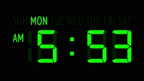 Loopable: Green LED Digital Clock Displays Current Time at Monday in 12-Hours Stock Footage 157342352