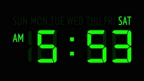 Loopable: Green LED Digital Clock Displays Current Time at Saturday in 12-Hours Stock Footage 157972271