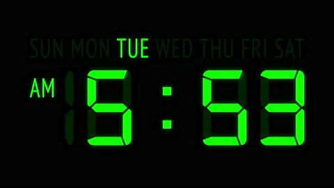Loopable: Green LED Digital Clock Displays Current Time at Tuesday in 12-Hours Stock Footage 162455140