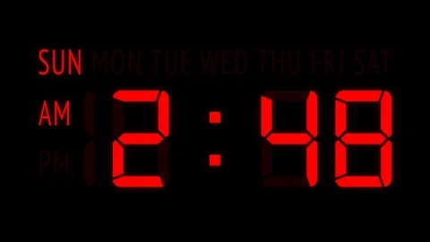 Loopable: LED Digital Clock Displays Week Days and Current Time in 12-Hours Stock Footage 124945344