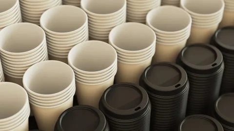 Loopable pan over a stack of disposable coffee or tea plastic cups and lids Stock Footage 292788139