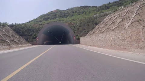 Loopable POV entering empty road tunnel then exiting. Stock Footage 64722832