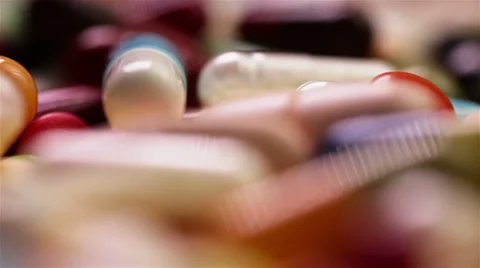 Loopable spinning pills Stock Footage 6733104