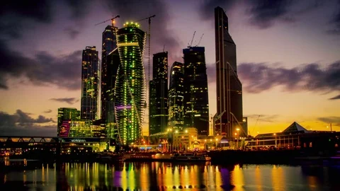 Loopable timelapse of modern city scyscrapers on sunset Stock Footage 74197095