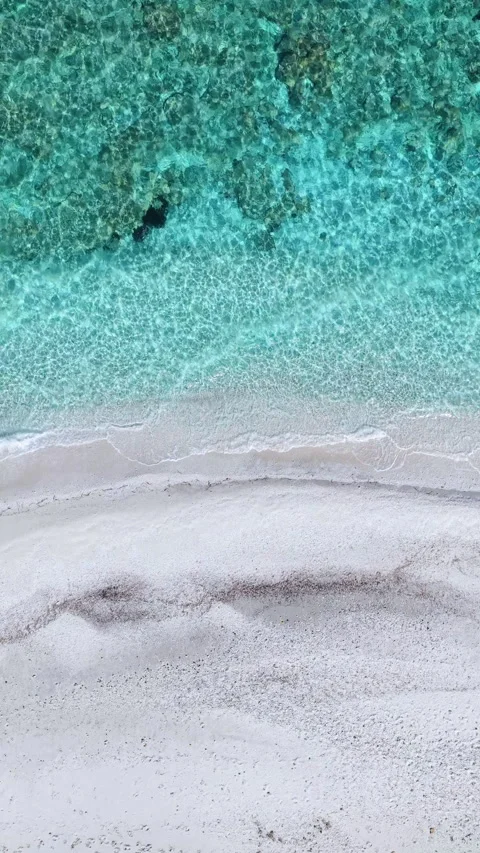 Loopable vertical top down view of a Sardinia beach Stock Footage 332438640