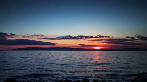 Loopable video of clouds moving in sky at sunset over Mediterranean sea Stock Footage 132427704