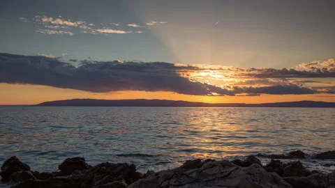 Loopable video of clouds moving in sky at sunset over Mediterranean sea Stock Footage 132634017