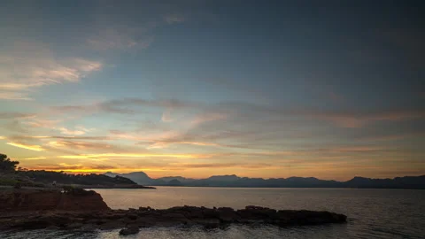 Loopable video of clouds moving in sky at sunset over Mediterranean sea Stock Footage 140143688