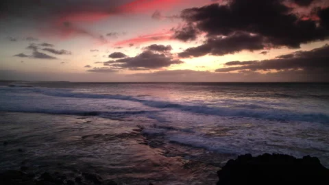Loopable video of clouds moving in sky at sunset over Mediterranean sea Stock Footage 141044234